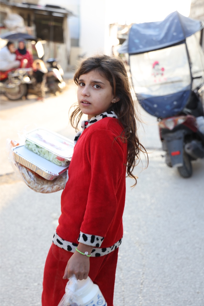 Mother and child with food packages